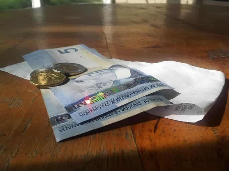 Tip money left at a restaurant table.